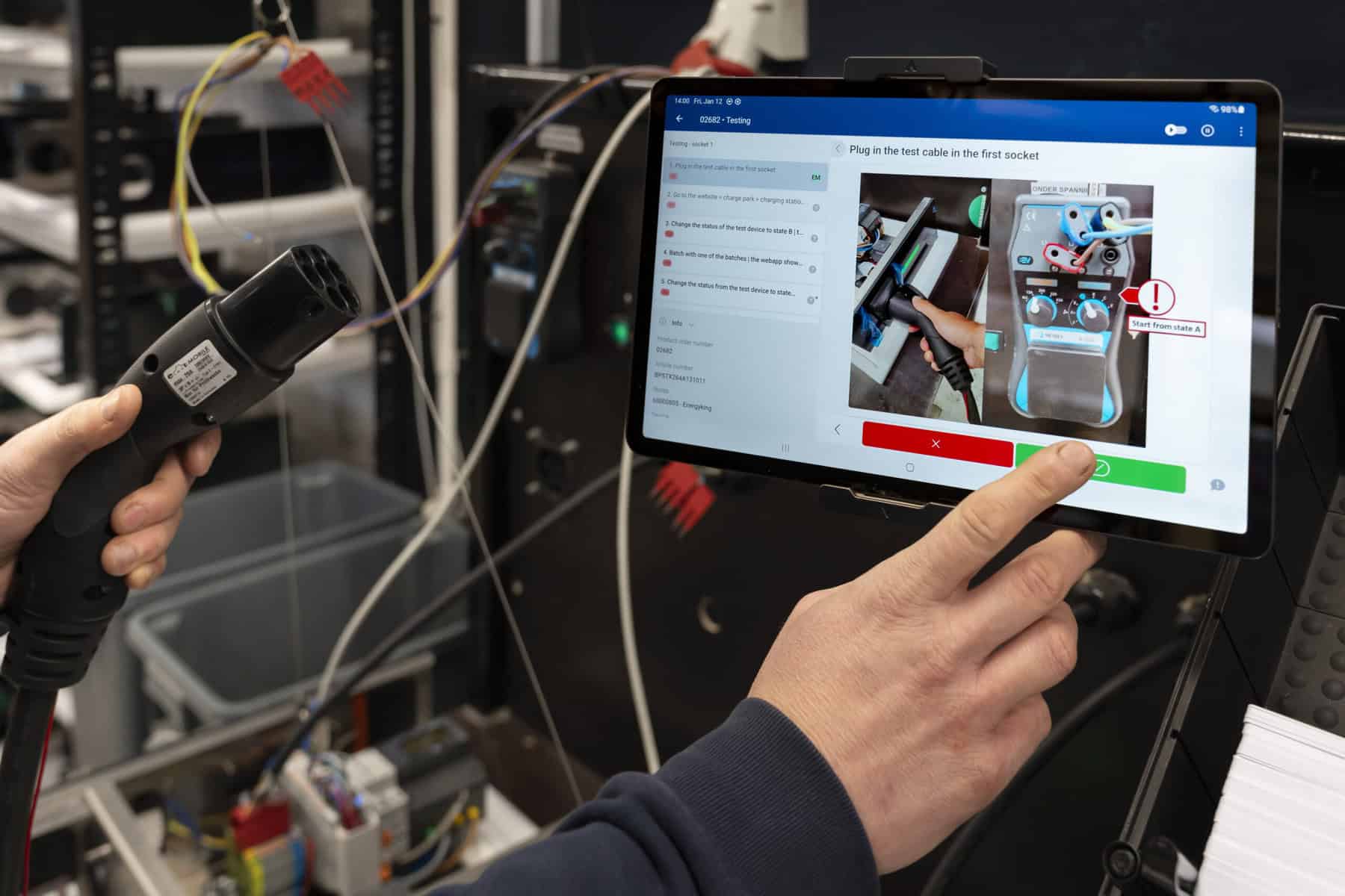 Operator using tablet for instructions